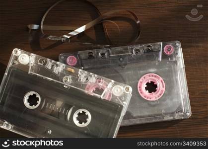 Audio tape cassettes with subtracted out tape. Old broken cassette