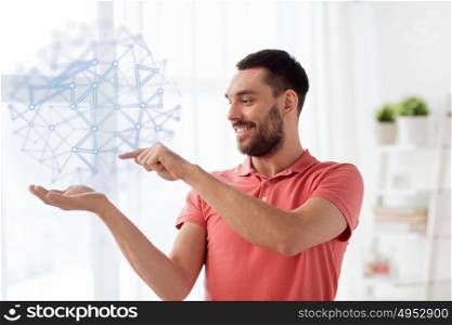 augmented reality, entertainment and people concept - happy man holding virtual polygonal projection on palm at home. man with virtual polygonal projection at home