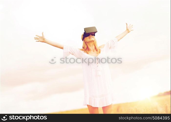 augmented reality, gaming, summer holidays, technology and people concept - happy young woman with virtual reality headset or 3d glasses on cereal field with raised hands. woman in virtual reality headset on cereal field. woman in virtual reality headset on cereal field