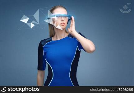 augmented reality, science, technology and people concept - beautiful woman in futuristic 3d glasses with virtual low poly projection over blue background. woman in virtual reality 3d glasses with hologram