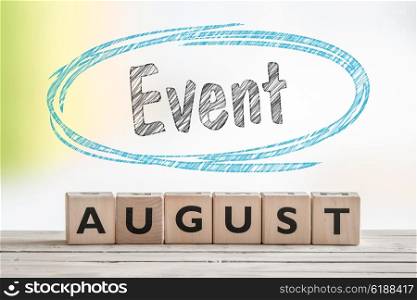 August event sign made of wood on a scene