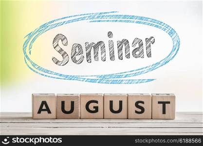 August seminar sign made of wood on a scene