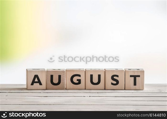 August sign on wooden cubes on a table