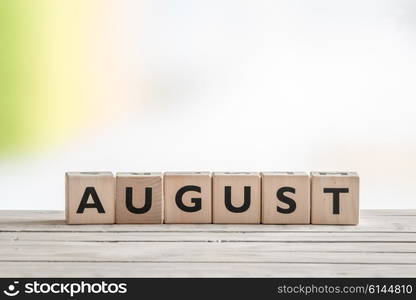 August sign on wooden cubes on a table