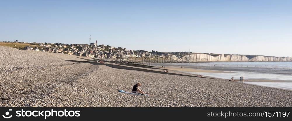 Ault, France, 5 august 2020: people walk on beach near Ault on the coast of french normandy