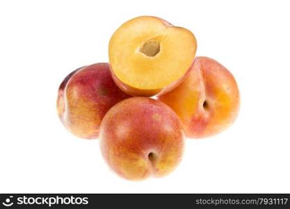 Aurora plums (prunus domestica) are a stone fruit with a groove running down on one side. They are sweet in taste and have yellow flesh.