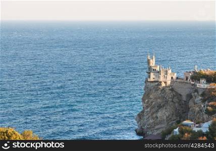Aurora rock with Swallow&rsquo;s Nest castle on Southern Coast of Crimea in evening