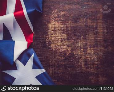 Australian Flag lying on the table. Place for your inscriptions. Top view, close-up. National holiday concept. Australia Flag. Beautiful, bright card. Top view