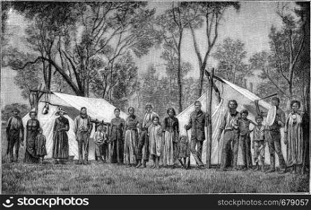 Australian Indians in front of their tents, vintage engraved illustration. From the Universe and Humanity, 1910.
