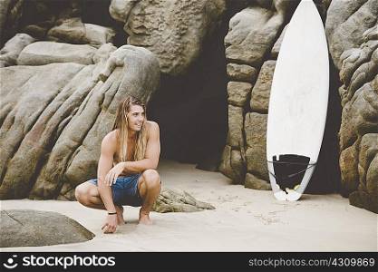 Australian surfer with surfboard, Bacocho, Puerto Escondido, Mexico