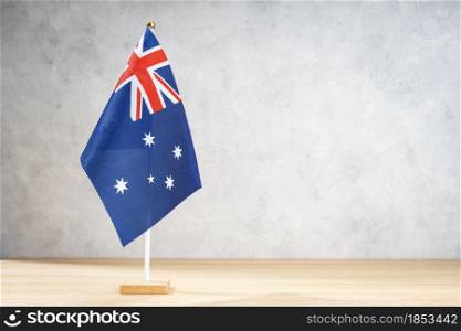 Australian table flag on white textured wall. Copy space for text, designs or drawings