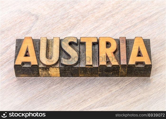 Austria word in vintage letterpress wood type against grained wood