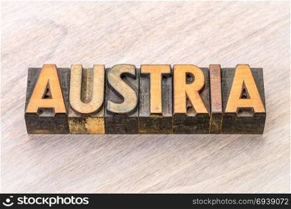 Austria word in vintage letterpress wood type against grained wood
