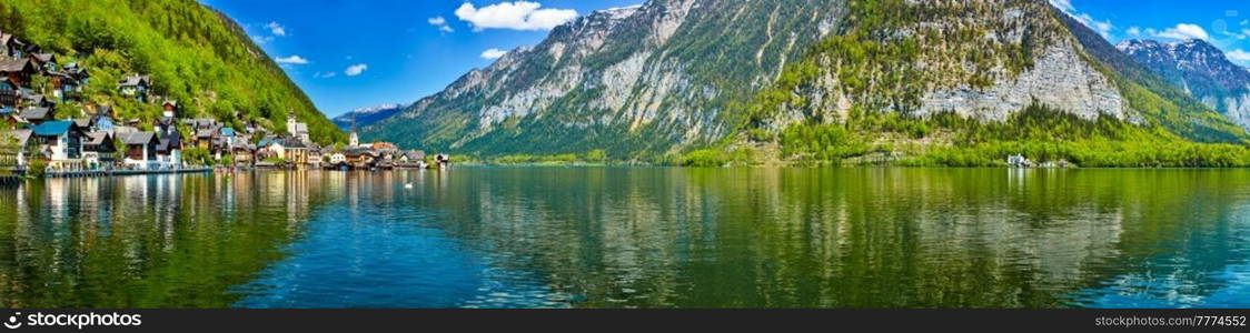 Austrian tourist destination - panorama of Hallstatt village and Hallstatter See mountain lake in Austria in Austrian alps. Salzkammergut region, Austria. Panorama of Hallstatt village and Hallstatter See, Austria