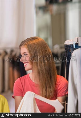 Authentic beautiful woman shopping in clothing store