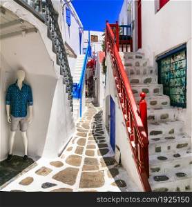 Authentic traditional Greece. Charming colorful streets of Mykonos island with fashion shops. Cyclades