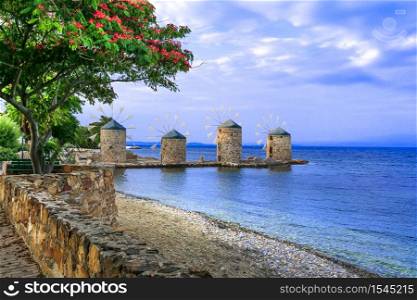 Authentic traditional Greece scenery - old windmills near the sea - landmark of Chios island. Old windmills of Chios island. Greece, Eastern Aegean islands