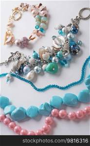 author  braceletes with pearls and gemstones. fashion and jewelry concept
