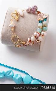 author gold  plated braclete with pearls and gemstones. fashion and jewelry concept