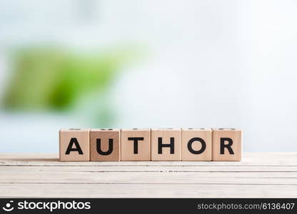 Author sign made of letters on a wooden desk