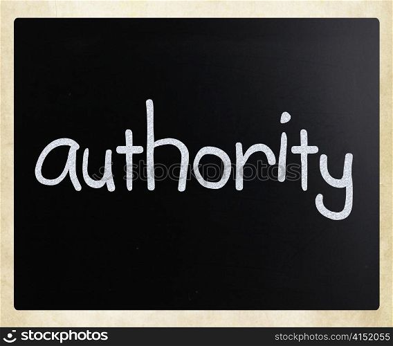 ""Authority" handwritten with white chalk on a blackboard"
