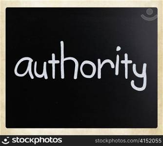 ""Authority" handwritten with white chalk on a blackboard"