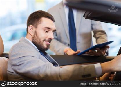 auto business, car sale, consumerism and people concept - happy man with car dealer in auto show or salon