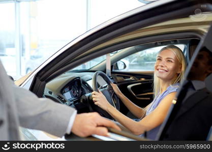 auto business, car sale, consumerism and people concept - happy woman with car dealer in auto show or salon