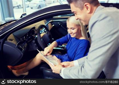 auto business, car sale, consumerism and people concept - happy woman with car dealer in auto show or salon