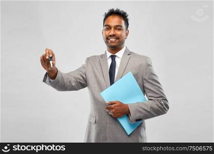 auto business, sale and people concept - happy indian man showing car key. happy indian man showing car key