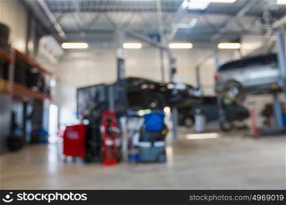 auto service and maintenance concept - car shop or repair station bokeh. car service station bokeh