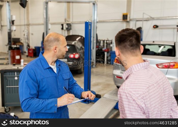 auto service, repair, maintenance and people concept - mechanic with clipboard and man or owner at car shop