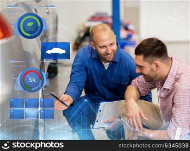 auto service, repair, maintenance and people concept - mechanic with clipboard showing tire to man or owner at car shop. auto mechanic with clipboard and man at car shop