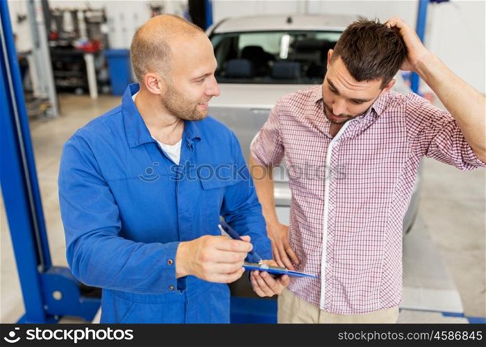 auto service, repair, maintenance and people concept - mechanic with clipboard talking to man or owner at car shop