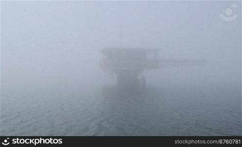 Automated gas production offshore platform in the misty sea of Azov