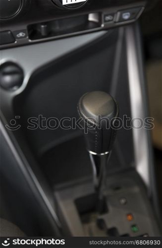 automatic gearstick inside of new car automobile, selective focus