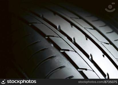 Automobile tire tread with a depth and light in the darkness , selective focus