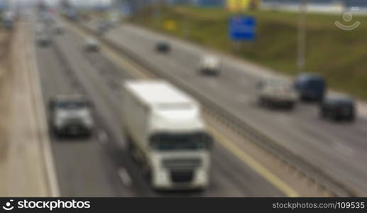 Automobile traffic on the highway the thematic blurred background