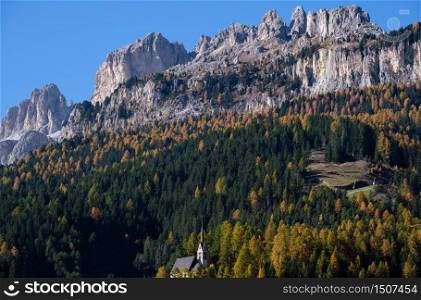 Autumn alpine Dolomites scene, Moena, Sudtirol, Italy. Peaceful rocky mountain tops view.