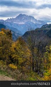 Autumn alpine Dolomites scene. Monte Civetta mountain top in far view from Livinallongo del Col di Lana, Belluno, Italy.