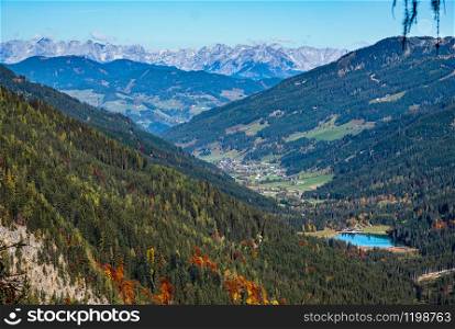 Autumn alpine Jaegersee lake view from mountain hiking path to Tappenkarsee, Kleinarl, Land Salzburg, Austria. Picturesque hiking, seasonal, and nature beauty concept scene.