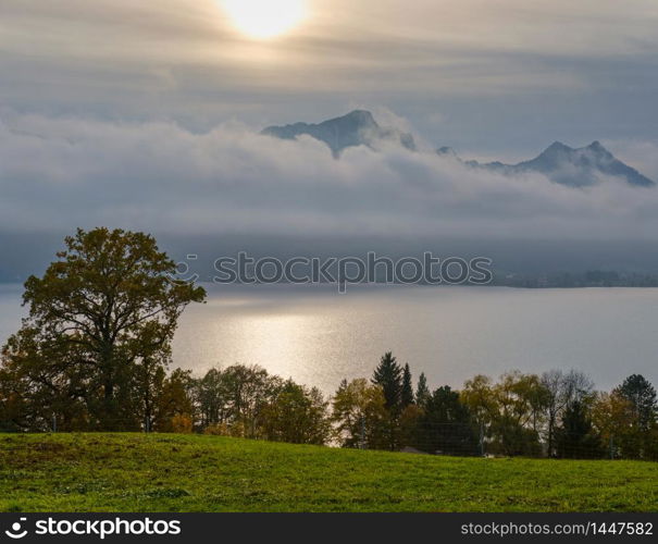 Autumn Alps mountain lake Mondsee foggy view from autobahn Raststation Mondsee terraces, Salzkammergut, Upper Austria. Beautiful travel, resting and nature beauty concept scene.