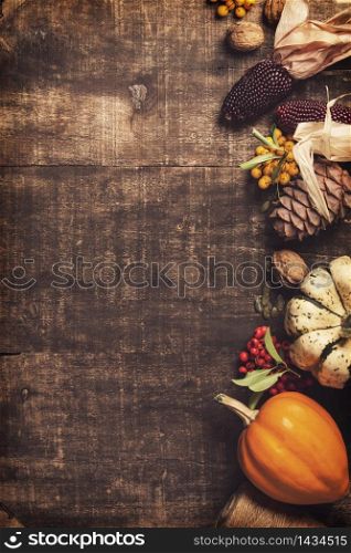 Autumn background - fallen leaves and healthy food on old wooden table. Thanksgiving day concept. Autumn background. Thanksgiving, harvest, halloween concept flat lay