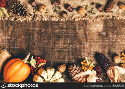 Autumn background - fallen leaves and healthy food on old wooden table. Thanksgiving day concept. Autumn background - fallen leaves and healthy food on old wooden table.