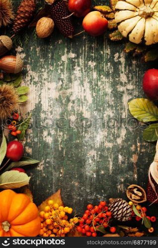 Autumn background with seasonal fruits, vegetables and leaves