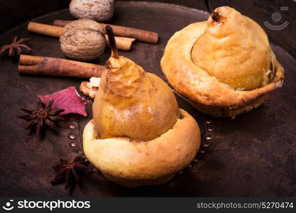 Autumn Baked Pear. Pear baked in dough with cinnamon and nuts