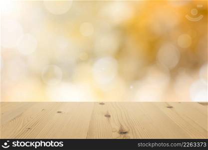 Autumn bokeh on Empty wooden table top with blurred defocus natural green bokeh background, aesthetic creative design