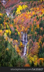 Autumn Bujaruelo Ordesa waterfal in colorful fall forest Pyrenees Aragon Huesca Spain