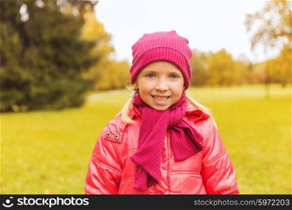 autumn, childhood, happiness and people concept - happy beautiful little girl portrait outdoors