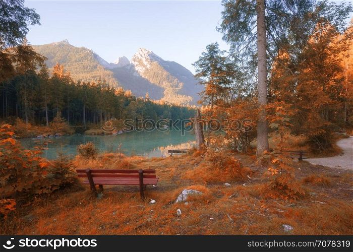 Autumn colors mountain lake at sunny morning